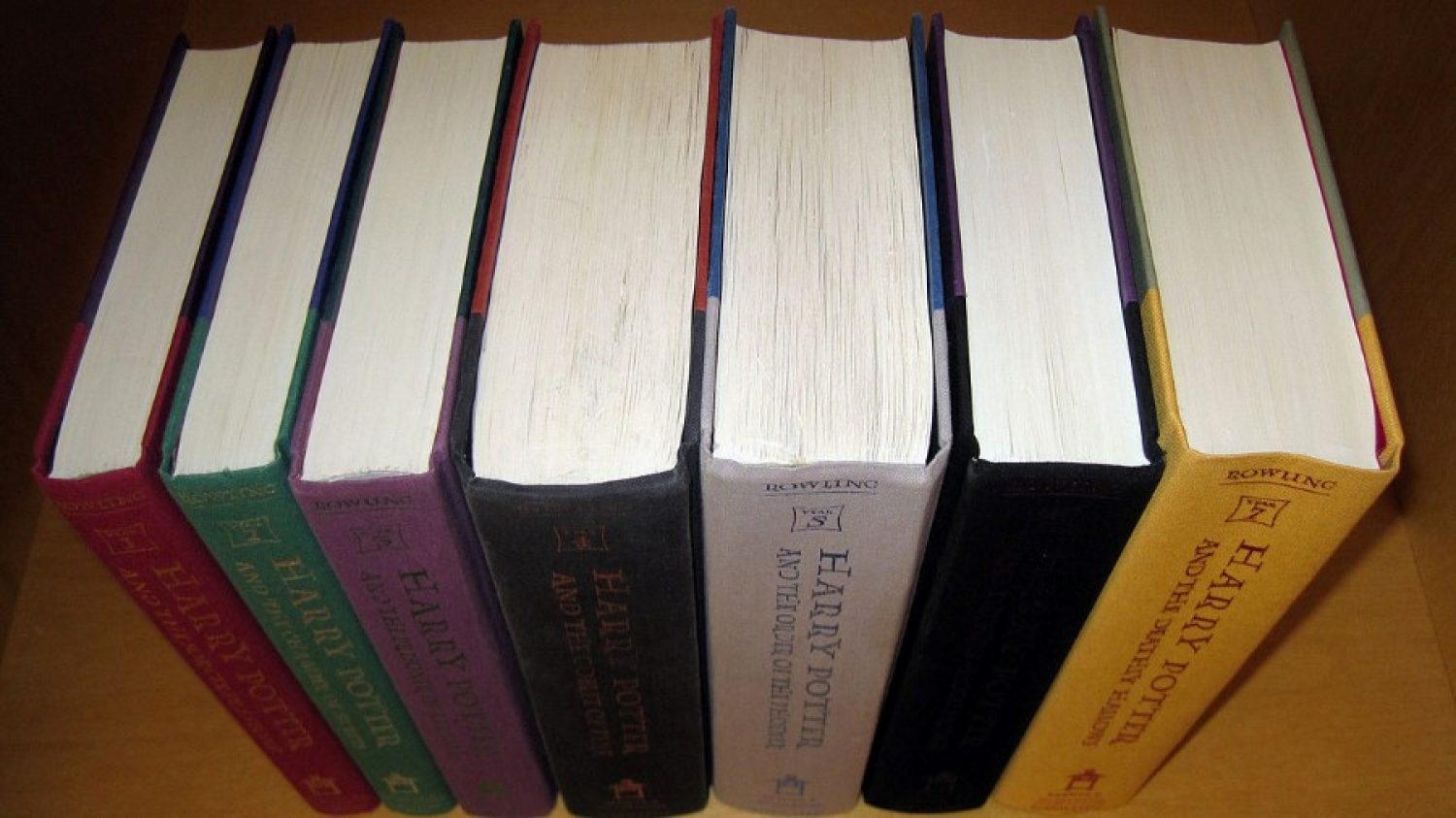 All seven books in the Harry Potter series in order without their dust jackets.