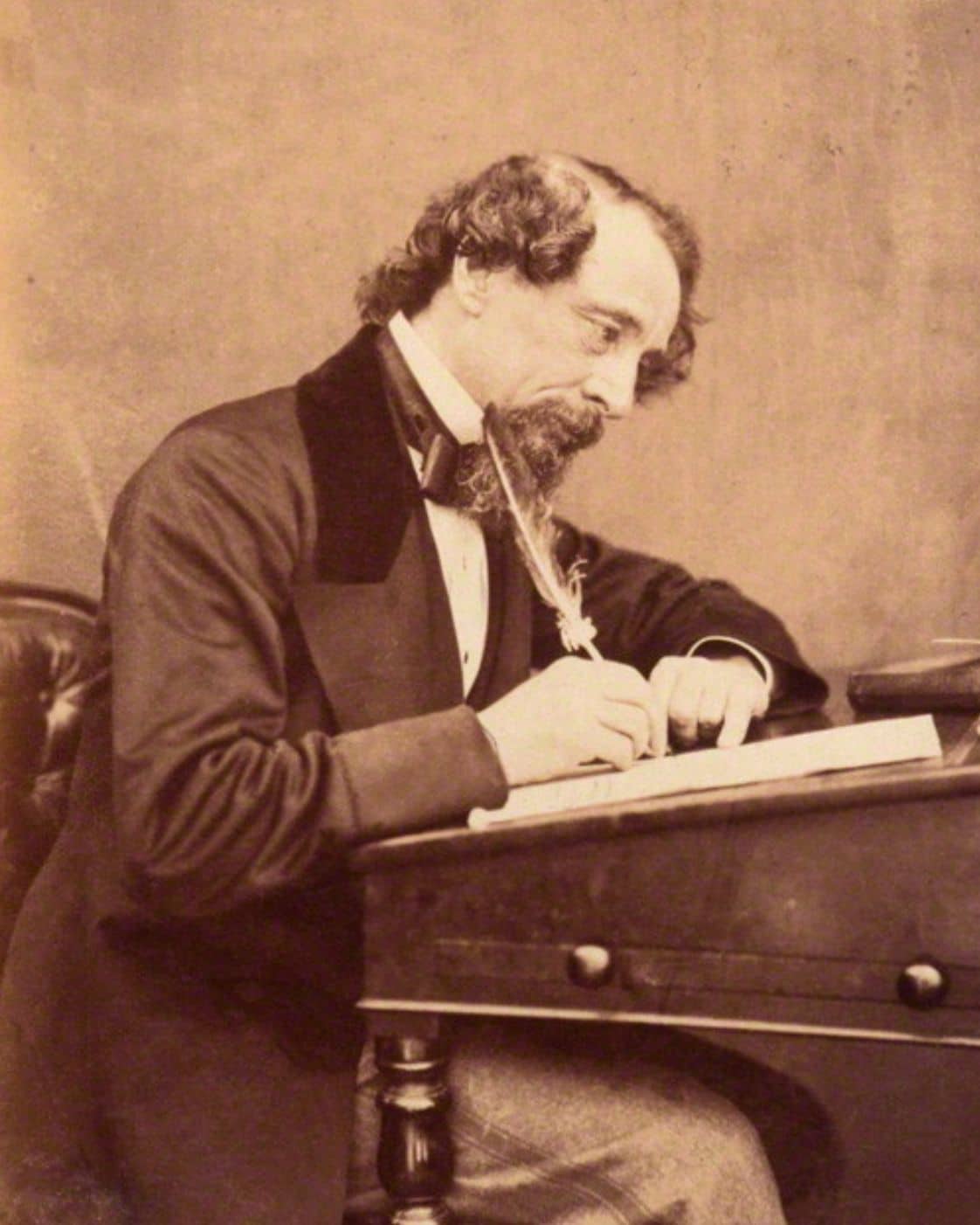 Charles Dickens at his desk, 1858